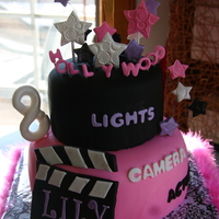 Lily's Hollywood Birthday 9" and 6" tiers, covered in fondant with fondant and gumpaste accents.Thanks for looking :)