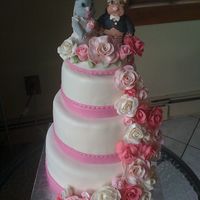 Liana's Wedding Cake Bride wanted a very traditional cake with roses cascading down the cake. She also wanted fondant replicas of her kitties to grace the top...