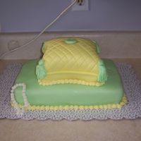 Practice Pillow Cake I made this as a practice cake. White and chocolate cake with buttercream filling, covered in fondant with fondant accents.