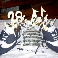 Musical Shoes These were carved and covered with fondant to look like my brother-in-laws favorite shoes. The sheet music was thin fondant and the music...