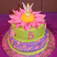 Tinkerbell A request for a joint party for two precious girls turning 5. 8" and 10" layers. Center of flower is a mini ball. All buttercream...
