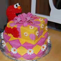 Elmo With A Present I was asked to do a "girly" Elmo cake for my friends daughter's first birthday. Got lots of inspiratons from CC (Thanks!)....