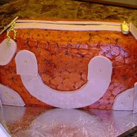 Orange Croc Purse Cake Buttercream icing and fondant accents. I let the fondant pieces dry on a cookie sheet before adding them to the cake, but that was a...