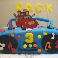 Boombox Cake Boombox carved out of sheet cake, covered in fondant. Wiggles and musical note are chocolate transfers.