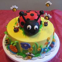Lady Bug Cake This was done for a 4 yr old who loves Ladyu bug. Buttercream with fondant accents. Lady bug is Rice krispie.