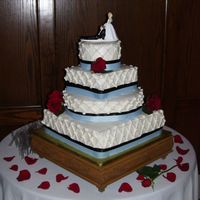 Round And Square this cake is Vanilla with Strawberries and cream filling(bottom), Banana chocolate chip (next) Key Lime (next) and vanilla (top) frosted...