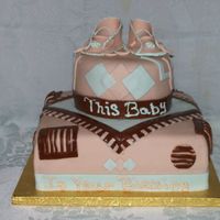 Baby Shoes This baby shower cake was decorated to match the baby's crib set and bedroom decor. Each layer was a different color.