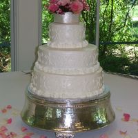 Round Wedding Cake This cake is carrot cake(top) Chocolate Obsession with chocolate chunk filling(middle) and Vanilla with raspberries and cream filling (...