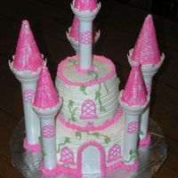 Wilton Castle Cake Used the new Wilton castle set to build this 2-tiered cake. It is completely done with buttercream - no fondant. The small cake is a 5-inch...