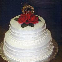 Ivory 50Th Anniversary Tiered Cake Ivory buttercream, silk flowers, and a golden plastic pick to celebrate 50 years