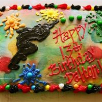 Paintball!! The paintballs are gumballs! The paintballer would have turned out better but the black icing was extremely soft!