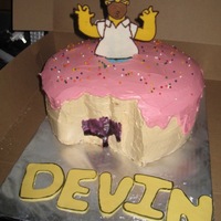 Homer Doh-Nut Two layer 12 inch white. Homer is a chocolate transfer and letters are fondant. Buttercream icing