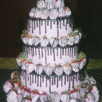 Pink Strawberries W/black Drizzle Birthday Cake for a big Celebration, has over 100 strawberries, the drizzle is actually chocolate. Thanks for Looking!