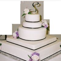 Simple Elegance This cake has some scroll work done that cant really be seen to well but up front it looked real elegant.