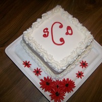 Red Gerber Daisies Wedding Shower cake for a coworker's daughter. Gold cake, Buttercream Frosting and fondat accents