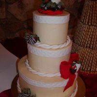 Buttercream Cake With Chocolate Strawberries She was a huge Texas A&M fan. Had a bonfire cake with it.
