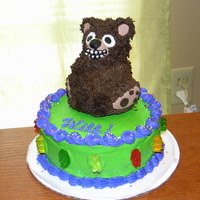 Bear Cake Quickie I made for my husband's Bday. Mini-stand up bear pan on top of 6" round. Those are gummi bears around the sides.