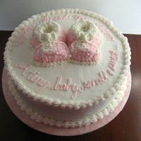 Baby Shower With Booties Vanilla cake with BC icing. Booties are made from cupcakes.