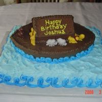 Noah's Ark Cake This was done for a little boy's second birthday. Vanilla cake with buttercream and chocolate buttercream icing. Animals are chocolate...
