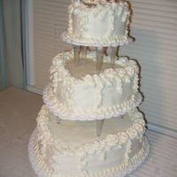 Heart Shaped Wedding Cake This cake was done for a second wedding reception. First and Third layers were vanilla and middle layer was chocolate. All covered in...