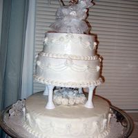 25Th Wedding Anniversary Cake This cake was done for a couple's 25th anniversary. Vanilla cake, buttercream icing with silver sugar balls and a regular cake topper...