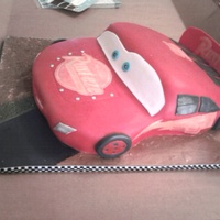 Lightening Mcqueen/cars Yellow cake with buttercream and covered in fondant.