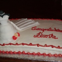 Bridal Shower This is a yellow cake covered in buttercream. The mannequin was made of a fondant/gumpaste mix...the bottom of the dress is cake made in...