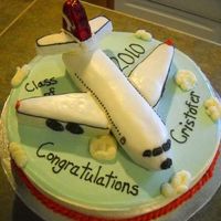 Airplane Graduation Cake carved the plane. The tail is rice krispy treats.