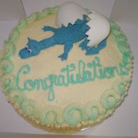 Hatching Baby Dragon Vanilla cake with raspberry filling and Buttercream Frosting. Gumpaste/Fondant Dragon and Egg.