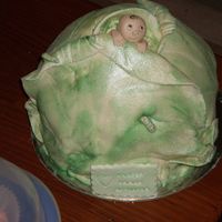 Naming Day Cabbage Patch Baby Buttercake with Devonshire Cream buttercream filling and frosting. Fondant/gumpaste leaves and baby.