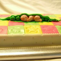 Peas In A Pod ... French Vanilla dh cake mix with coat of bc and covered in mmf colored and cut out to match a baby quilt made by the babies grandmother and...