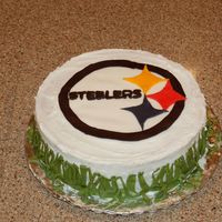 Pittsburg Steelers My 13 year old daughter made this cake for her teacher using a fondant logo on a buttercreme frosted cake. She printed the logo from the...