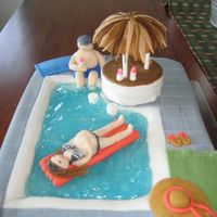 Baby Shower/pool Party Cake Sis-in-law is pool party crazy so it seemed natural to do this cake for her baby shower. Decided dad would now be holding bottles instead...