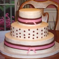 Pink And Brown Ribbons This cake really should have been done in fondant but the couple wanted buttercream. I was disappointed that I couldn't get the...