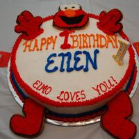 Elmo 2 This was the second cake I made for my daughter's first b-day. Elmo is an overbaked sugar cookie.