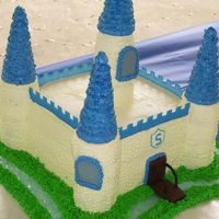 Castle Cake The mom didn't want a "war" castle cake. She wanted a "prince" cake. It is 8" with cupcakes as the towers,...