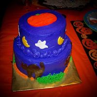 Birthday Halloween Cake Bottom cake is devil's food with chocolate hazelnut cream filling, top cake is cookies & cream cake with marshmallow buttercream...