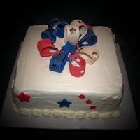 Labor Day Weekend / Birthday Cake Coconut cream cake iced in marshmallow buttercream. Bow and decorations from MMF.
