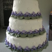 Violet Cake for a friends small outdoor wedding. She wanted purple flowers and ivory icing. MMF and violets fit her specifications perfectly.