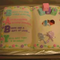 Baby Shower Cake Cake from 2006 Wilton's Book. Blocks out of fondant since I couldn't find any to purchase. Baby borrowed from a dear friend who...