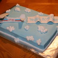 Aaron's 80Th Birthday Cake 80th Birthday cake for a pilot instructor. 1/2 WASC and 1/2 Darn Good Chocolate Cake.Airplane & Banner made of fondant/gumpaste.My cute...