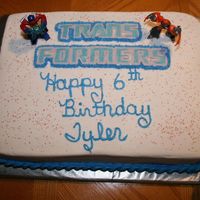 Tyler's Transformer Cake Darn Good Chocolate Cake with b/c, made for my grandson's 6th birthday.The Transformer Logo is a Chocolate Transfer. First time making...