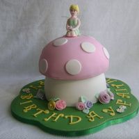 Tink Made for my daughter's 3rd birthday. Mushroom stem is two 8" rounds carved to the desired shape. Top was baked in a Pyrex bowl....