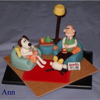 Wallace And Gromit Model made of marzipan and sugarpaste. Entirely edible with the exceptions of the knitting needles and the post of the lamp. Based on a...