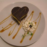 Mini Chocolate Hearts For My Love for my loved-one on our annivercerychocolate sponge cake banana filling and chocolate icing, decorated with caramel, cream and fresh mint