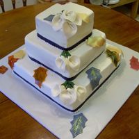 Fall Wedding Cake A fall wedding cake for a friend of mine and my mothers. Leaves are fondant painted on w/ gold and silver lust dust and watered down dye....