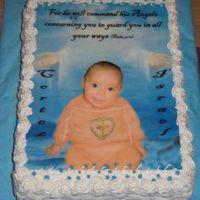 Christening Cake 2 Layer Carot Cake with Raisins and chopped Pecans, filled with Cinnamon Frosting. Edible Image and decorated with BC and Cake Glitter