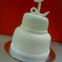 Fondant Mini Cake This is a mini cake I made for a coworker birthday. Its a cupcake on top of a tuna tin sized cake. Choc mud cake with white choc cream...