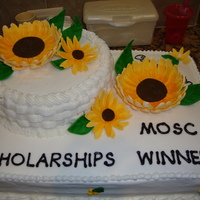 Sunflower Cake Buttercream with gum paste sunflowers and leaves.