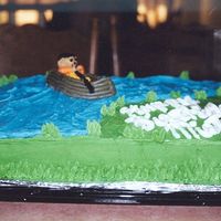 Gone Fishing all decorations are buttercream except fishing pole is a lollipop stick covered in black icing.